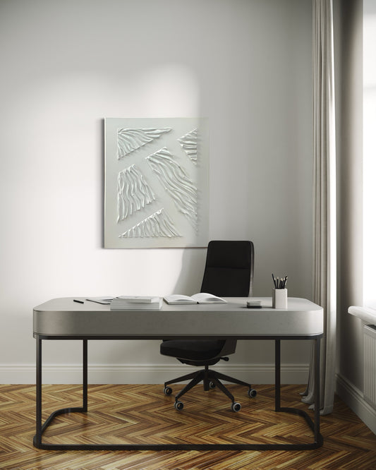 Descriptive picture of a white textured art piece having over a desk